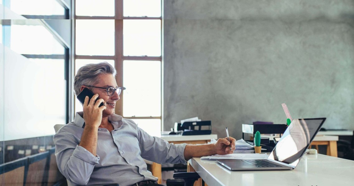 a man at his desk at his place of employment