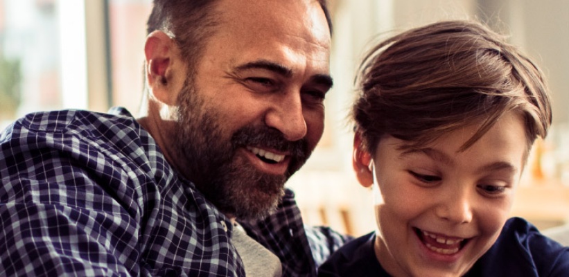 father and son smiling